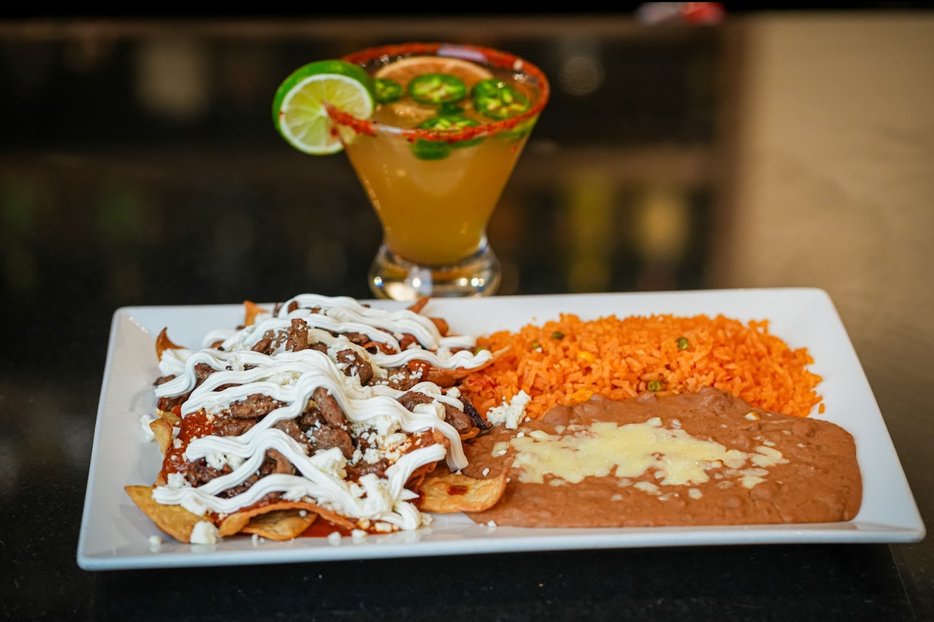 Mexican specialty plate with rice and salsa