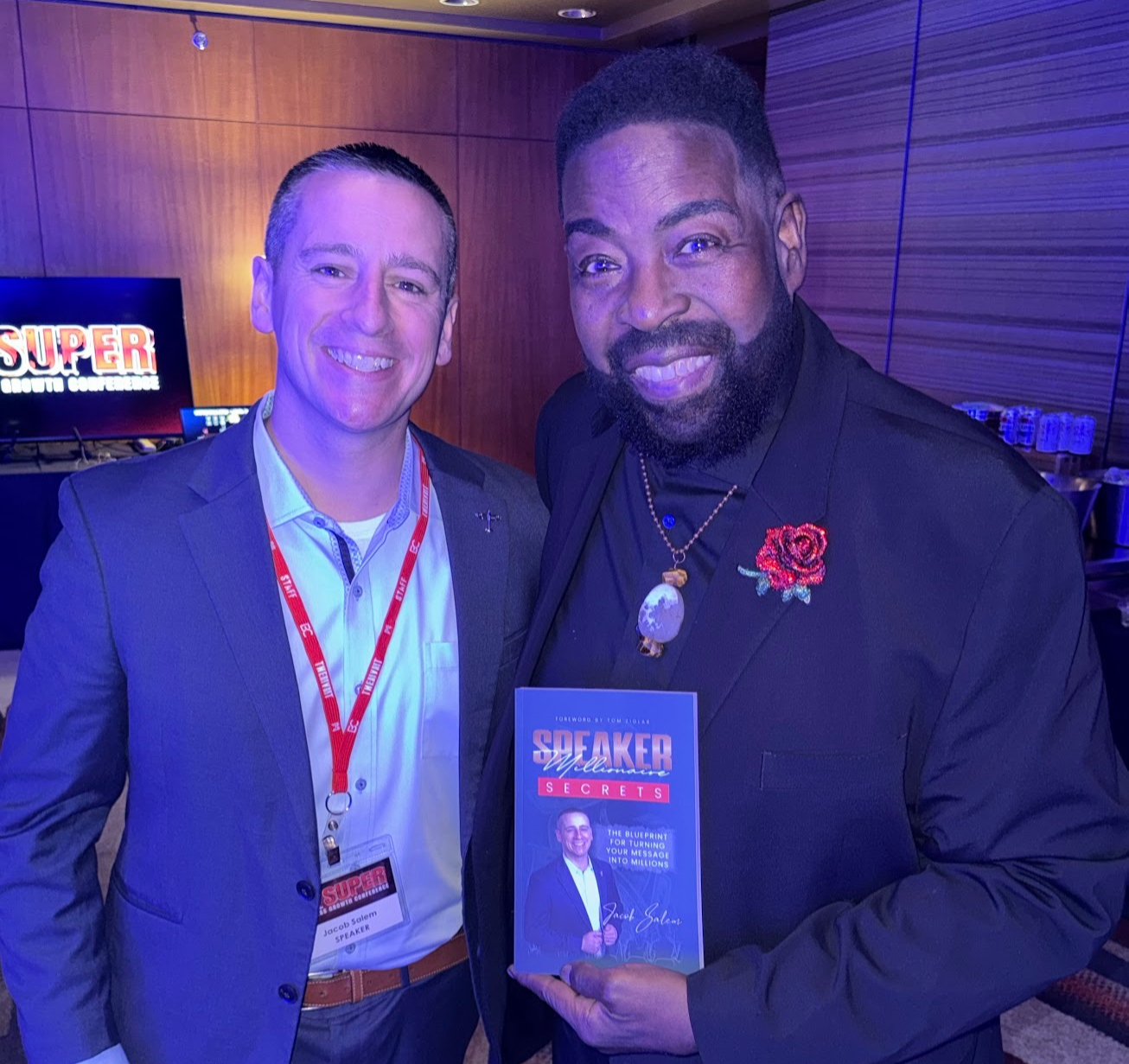 Billy Cox holding Speaker Millionaire Secrets with Jacob Salem