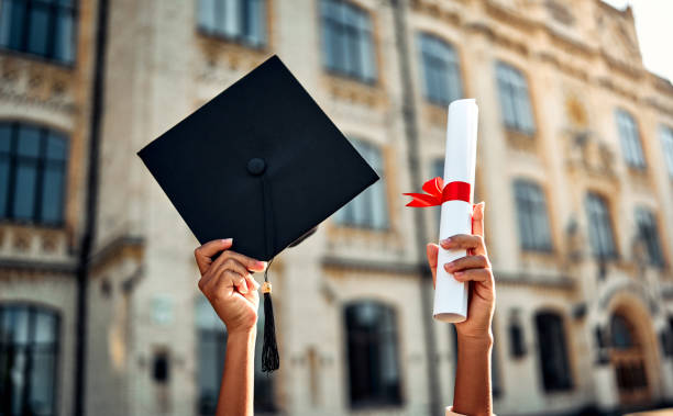 Graduate holding a cap and diploma