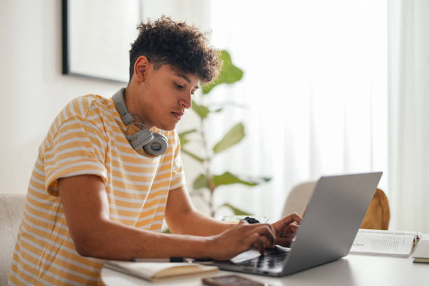 Learner studying at a laptop during an online lesson