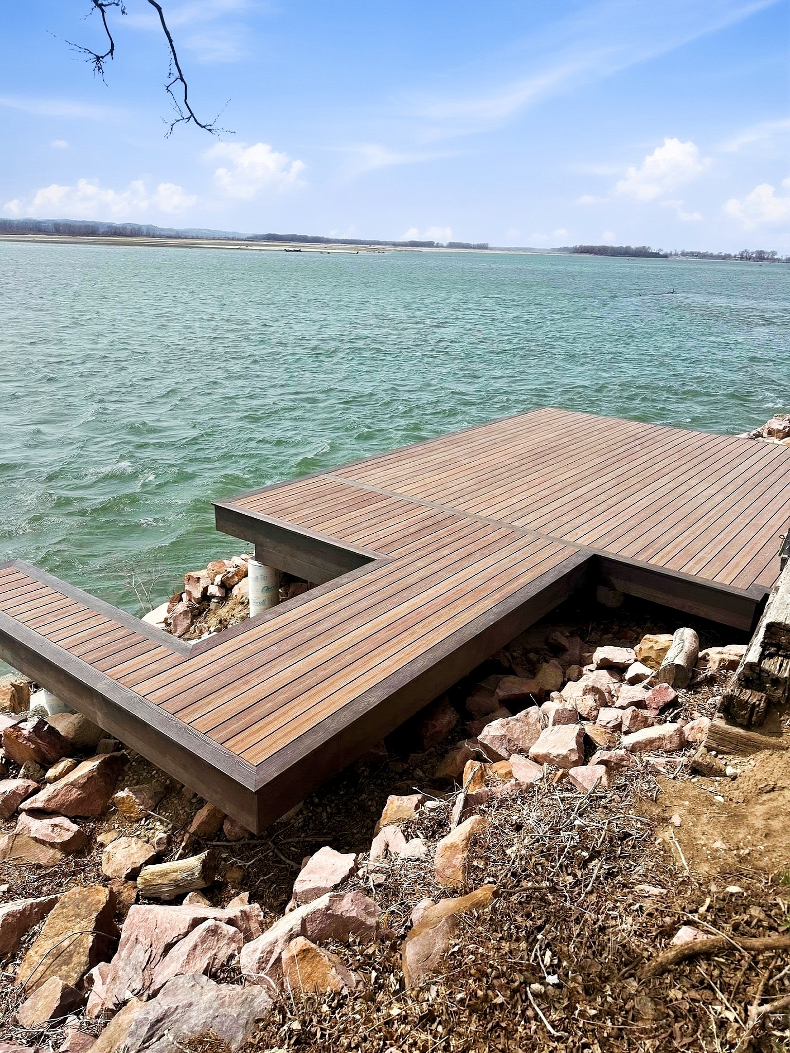 Finished deck overlooking a lake on a custom home in Siouxland