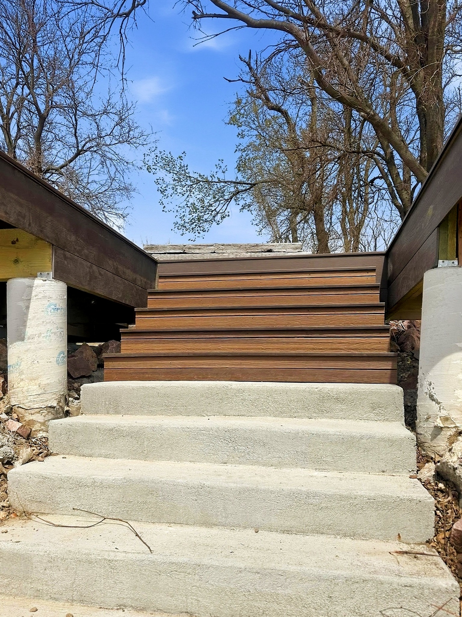 Finished deck with steps on a custom home in Siouxland