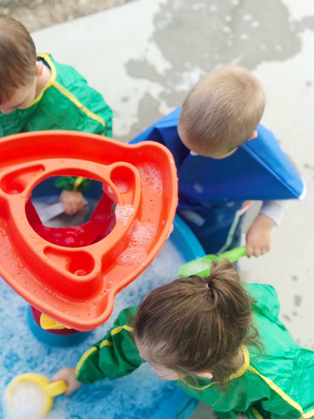 Toddlers exploring a sensory activity