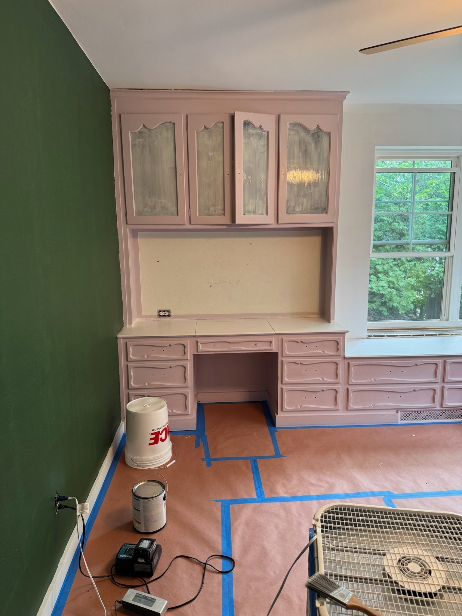 Built-in desk and cabinets painted pink before cabinet painting by Gwyn & Sons Built-in desk and cabinets painted pink before cabinet painting by Gwyn & Sons