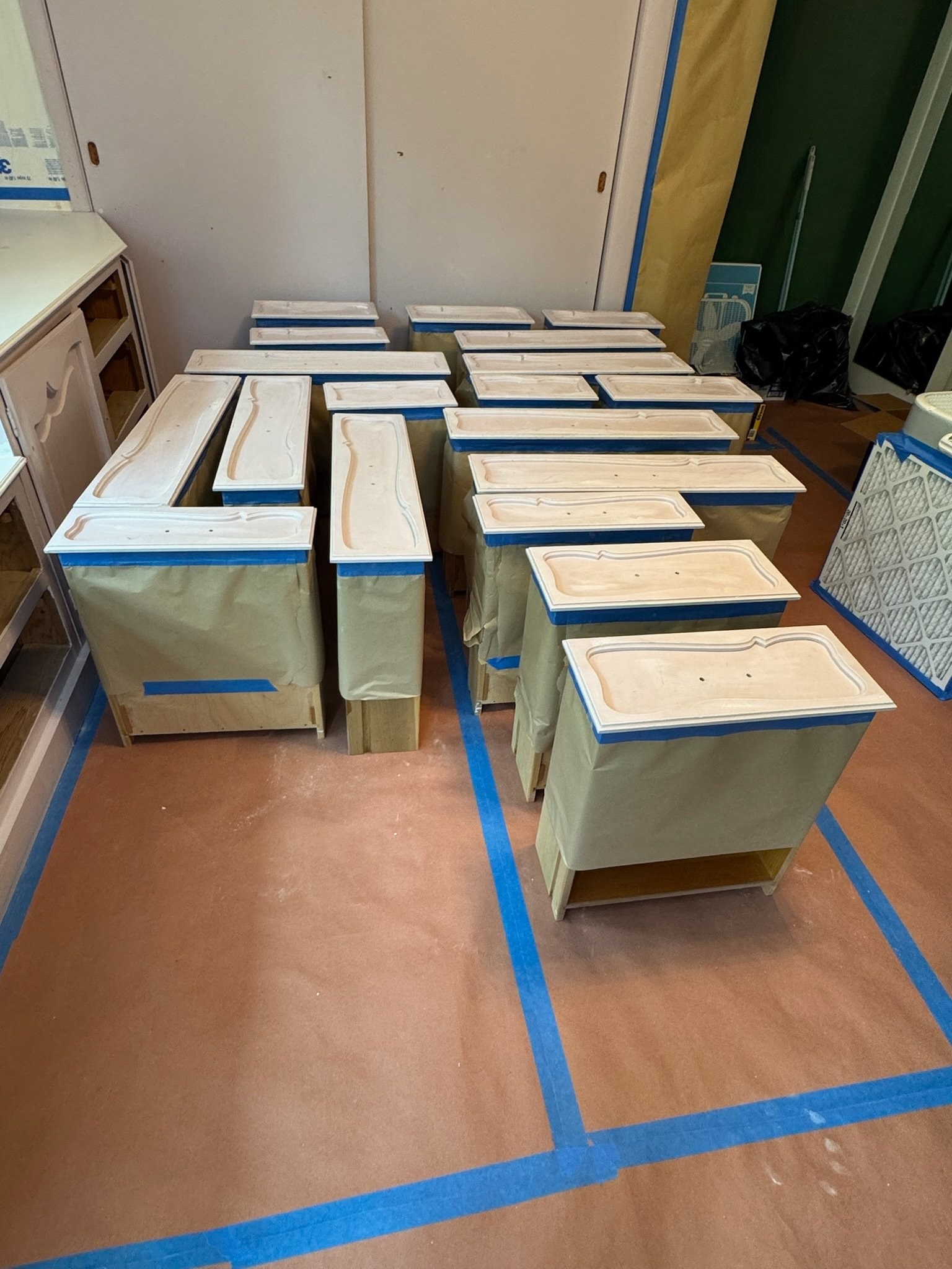 Cabinet drawer fronts sanded and primed during cabinet painting by Gwyn & Sons Cabinet drawer fronts sanded and primed during cabinet painting by Gwyn & Sons
