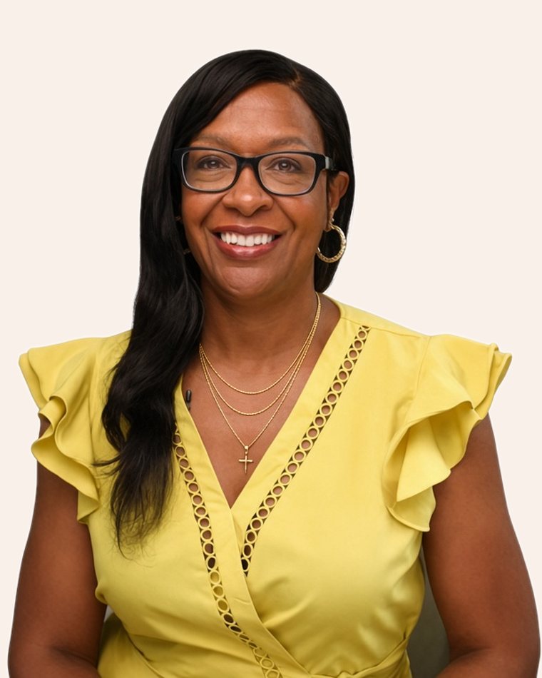 Jae Brown, founder of Clarity Before Commitment, smiling in a yellow top