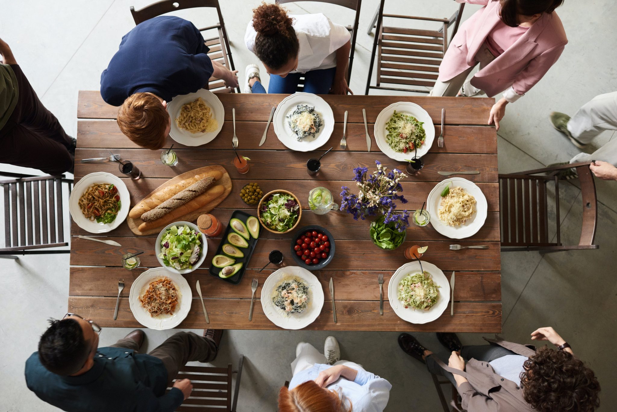 fresh avocado halves served at a family dinner with assorted dishes