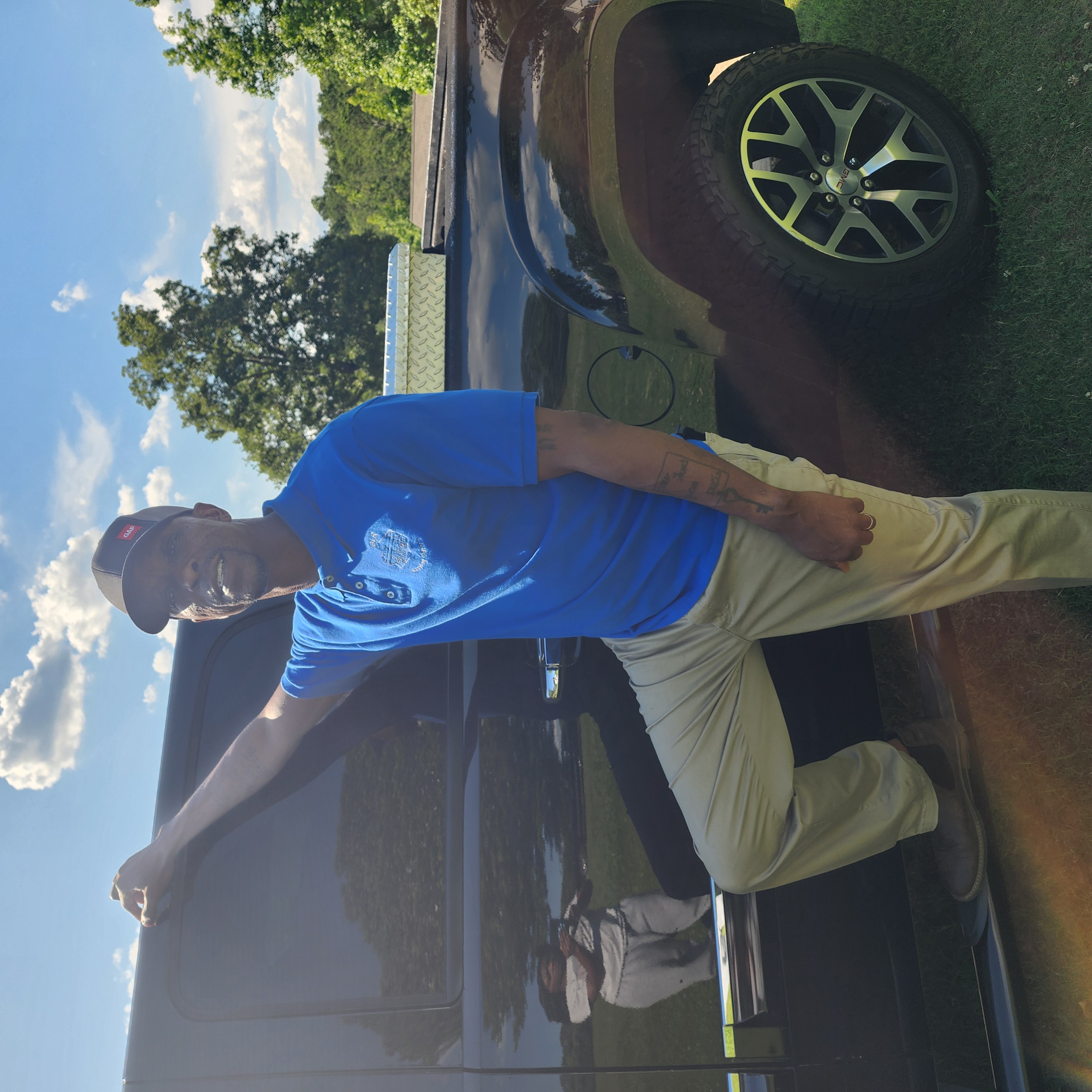 Graceful Living Roofing contractor inspecting hail-bruised shingles on a suburban home in Loganville, GA after a storm