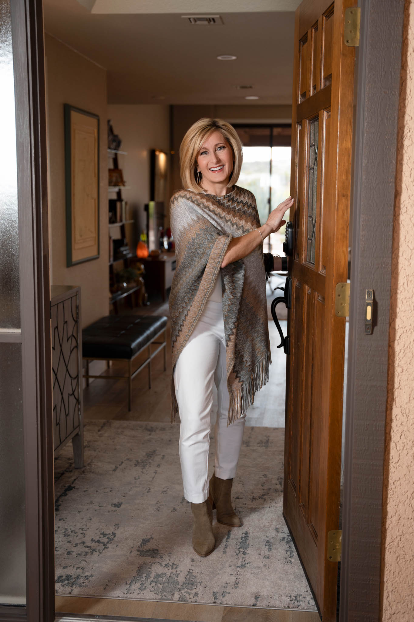 Welcoming business owner standing in doorway, approachable and confident lifestyle branding image | Jessica Korff Studios Tucson, AZ