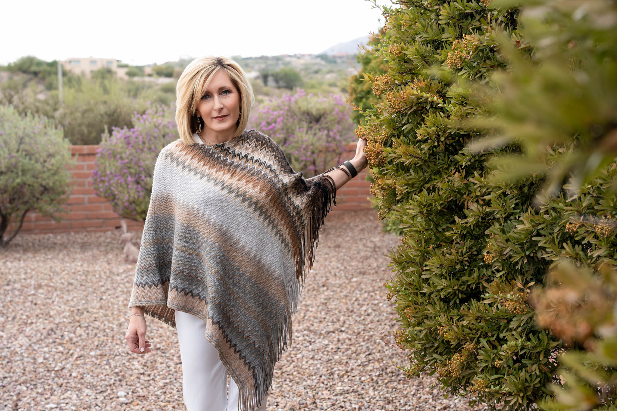 Outdoor lifestyle branding image of confident woman walking through desert landscape | Jessica Korff Studios Tucson, AZ