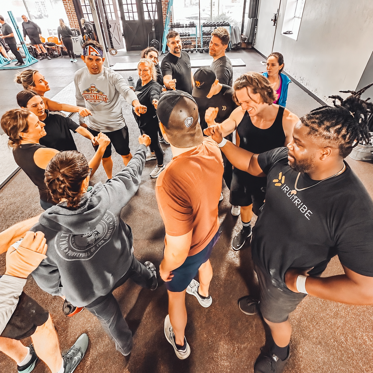 Iron Tribe Athletes Circle Up For Breakdown At End Of Class