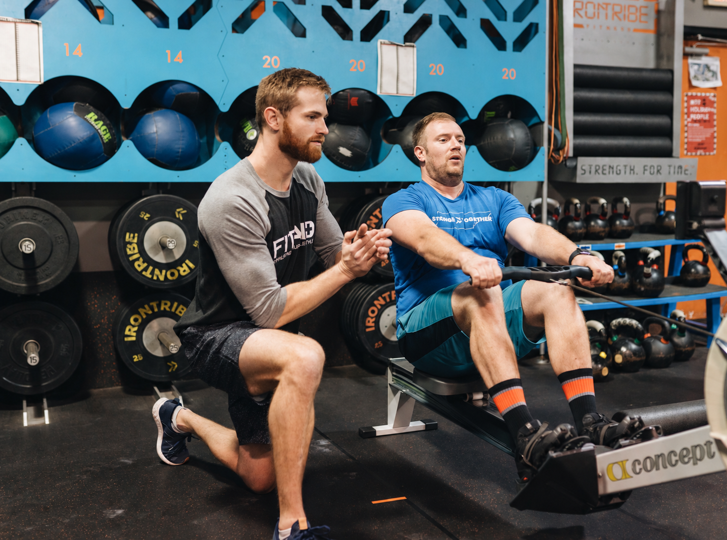 Coach Coaching with an athlete at Iron Tribe