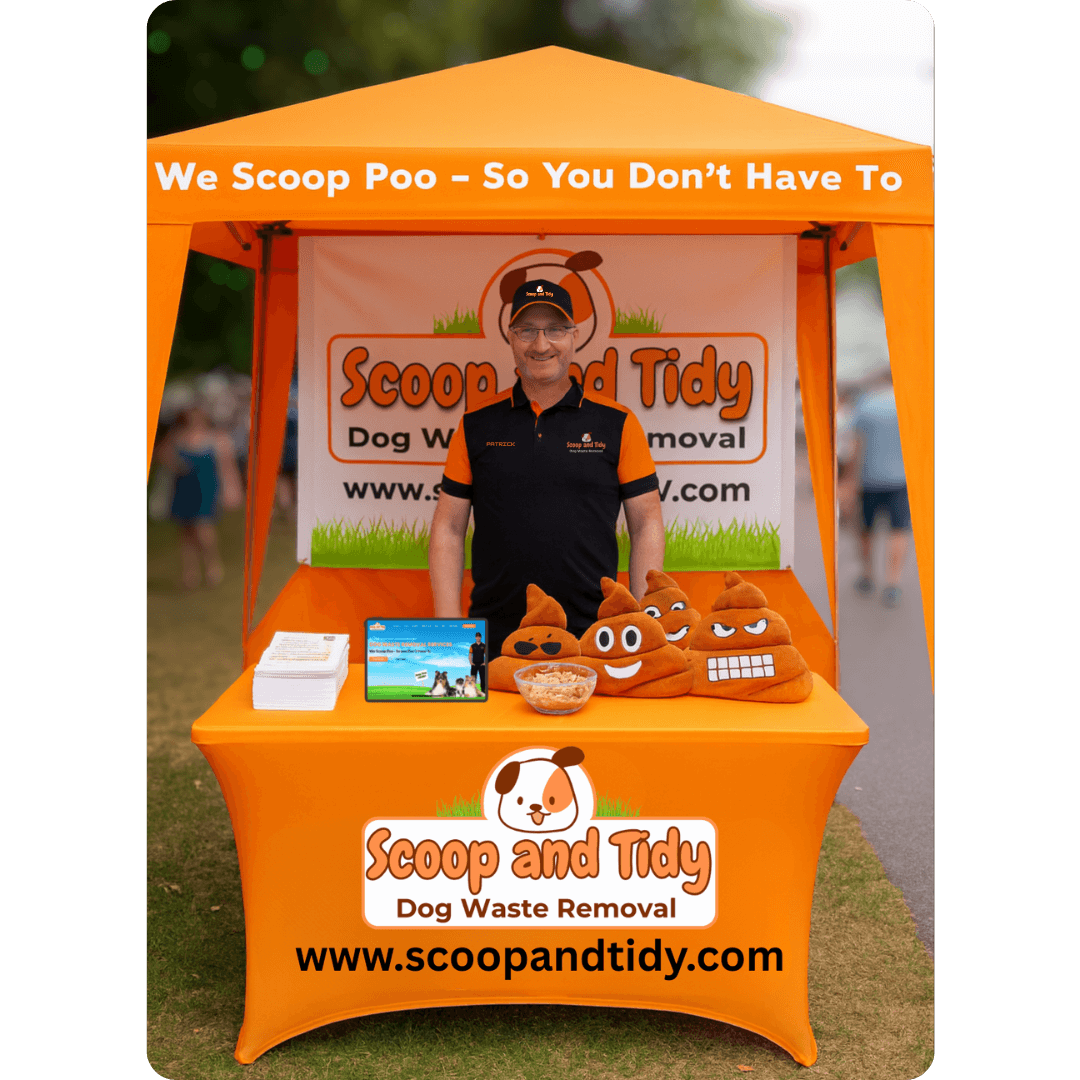 image of the owner of Scoop and Tidy standing at his booth at an outdoor event