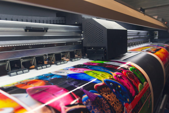 Large format printer producing custom banner graphics