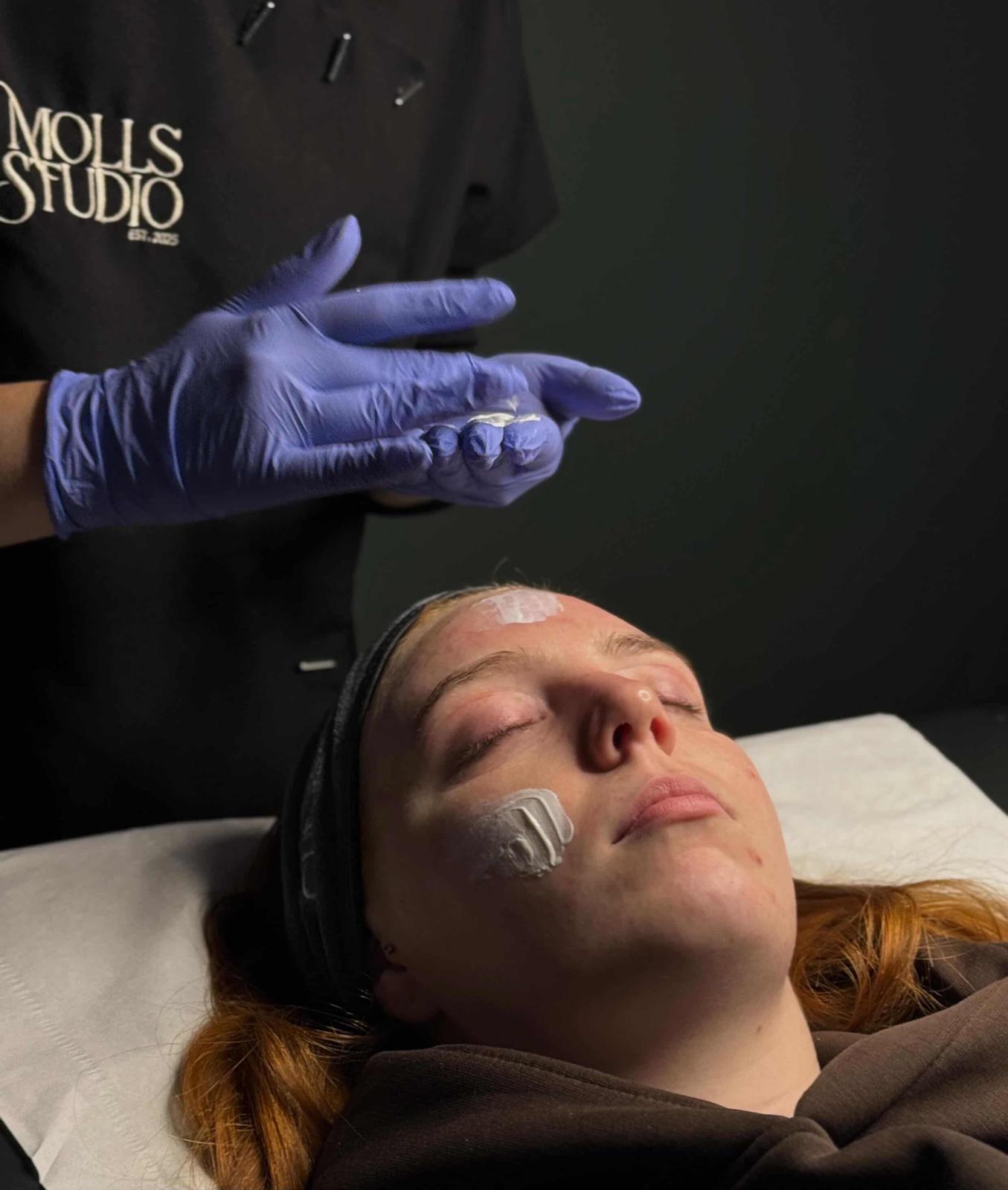 A professional facial in progress — quiet, unhurried, and precise.