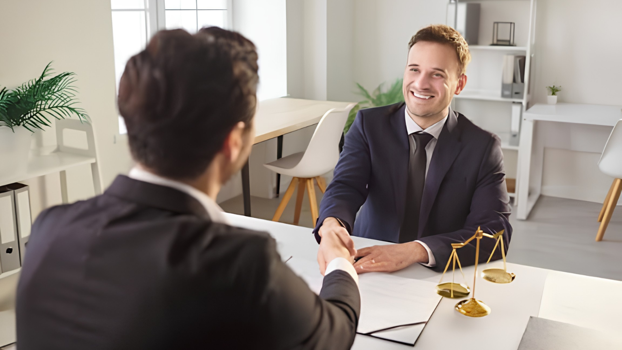Client shaking hand with lawyer Client shaking hand with lawyer