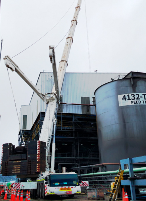 Telescopic crane on an industrial site