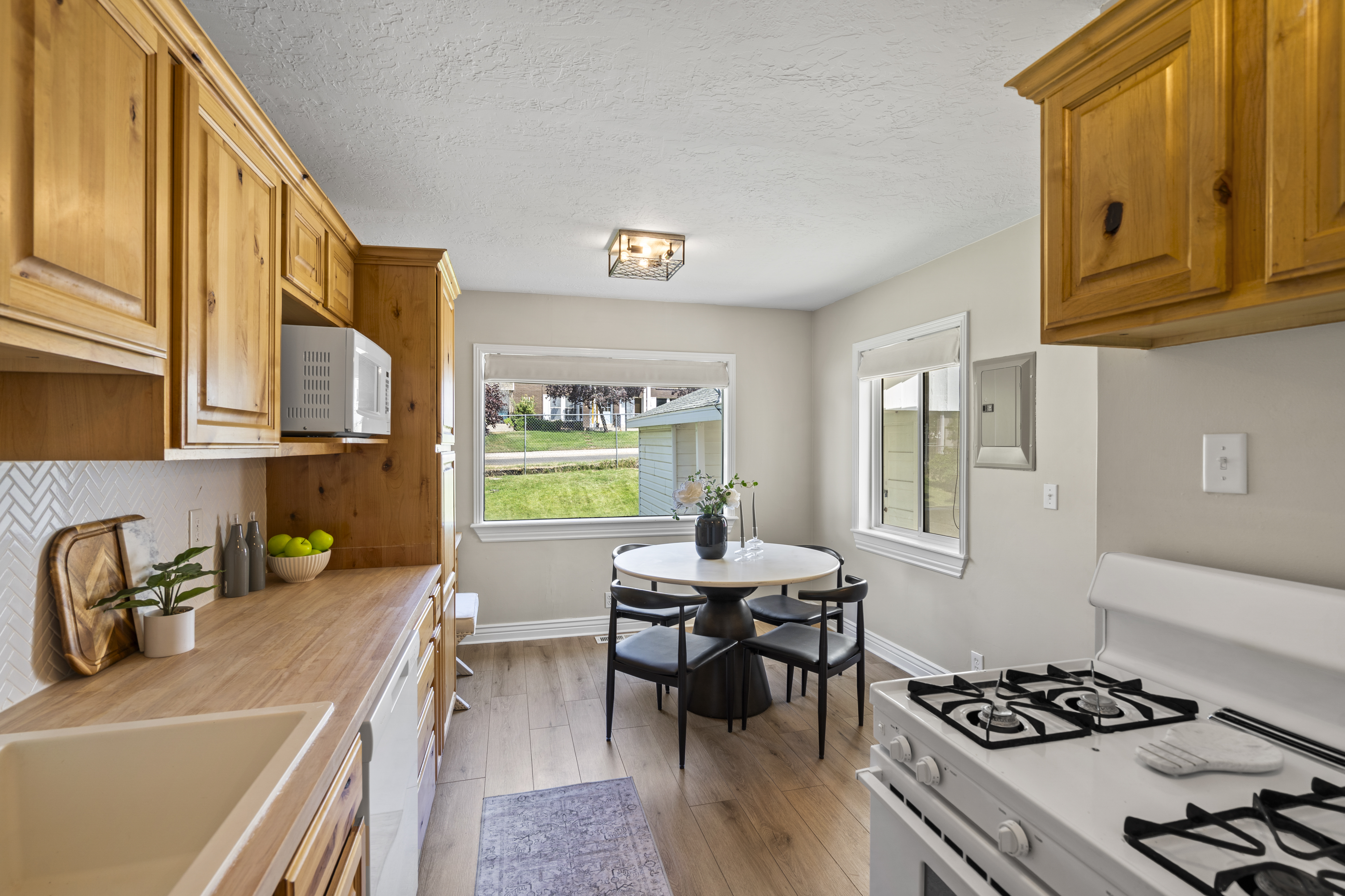 Kitchen with wood cabinets and an adjoining dining nook