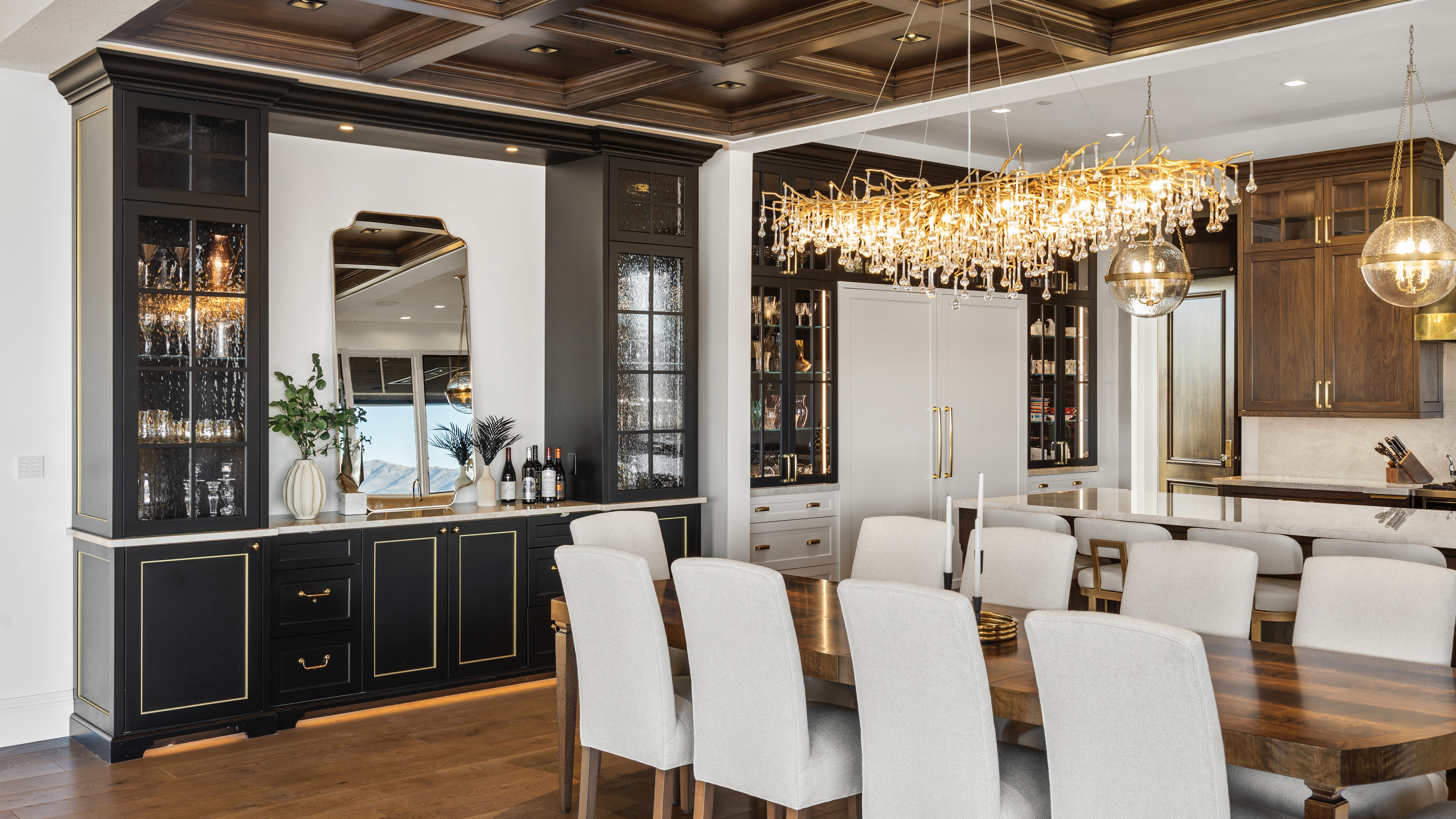Formal dining room with a crystal chandelier and built-in cabinetry