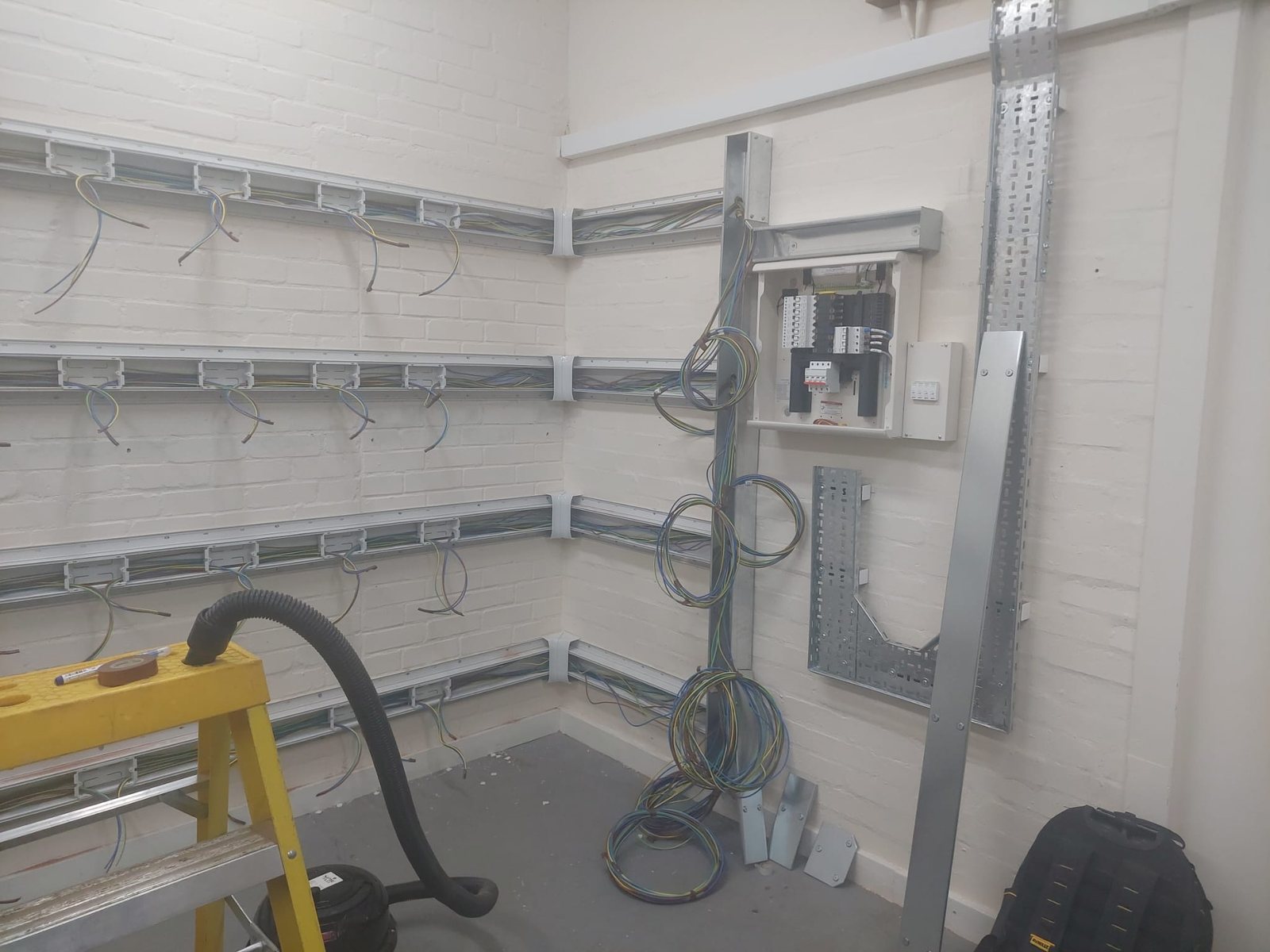 Commercial workshop with conduit, trunking and distribution board by Cord Electrical