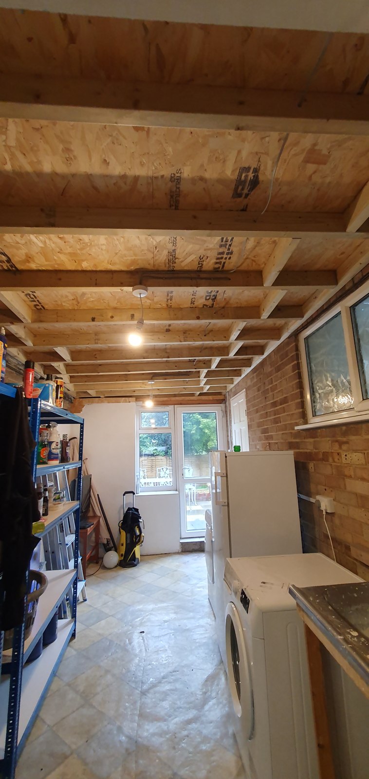 Strip lighting fitted between exposed timber joists
