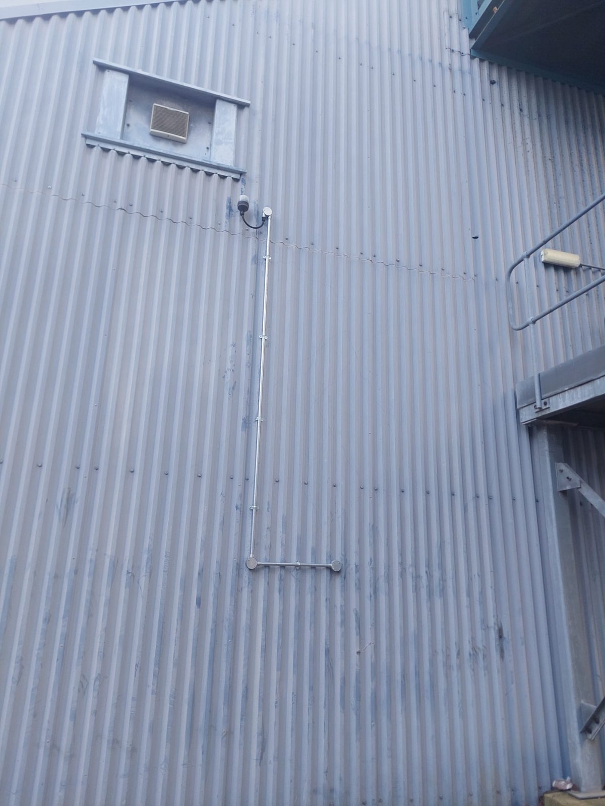 Surface conduit installed on profiled metal cladding