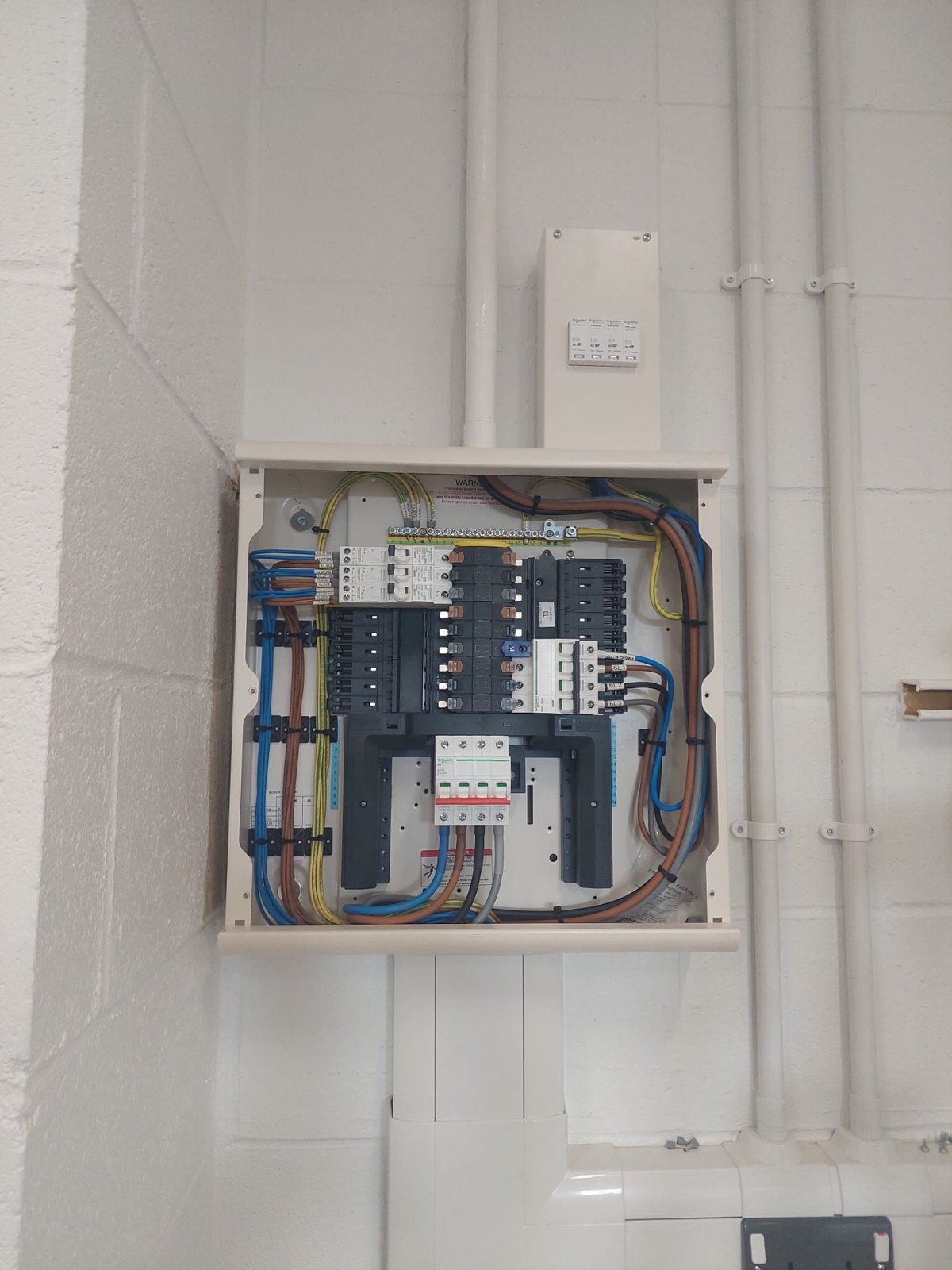 Control panel interior with breakers and terminal rails