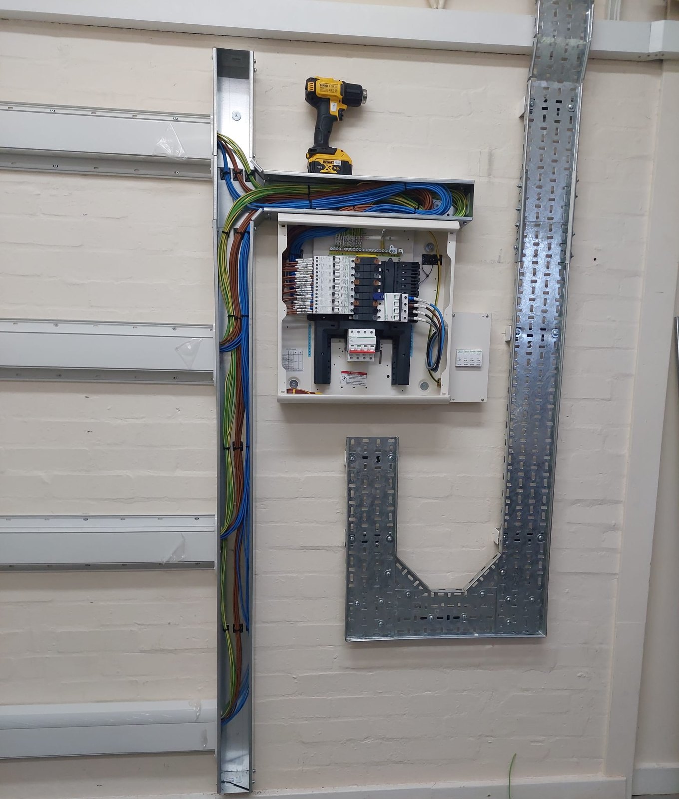 Control panel with cable tray and containment alongside