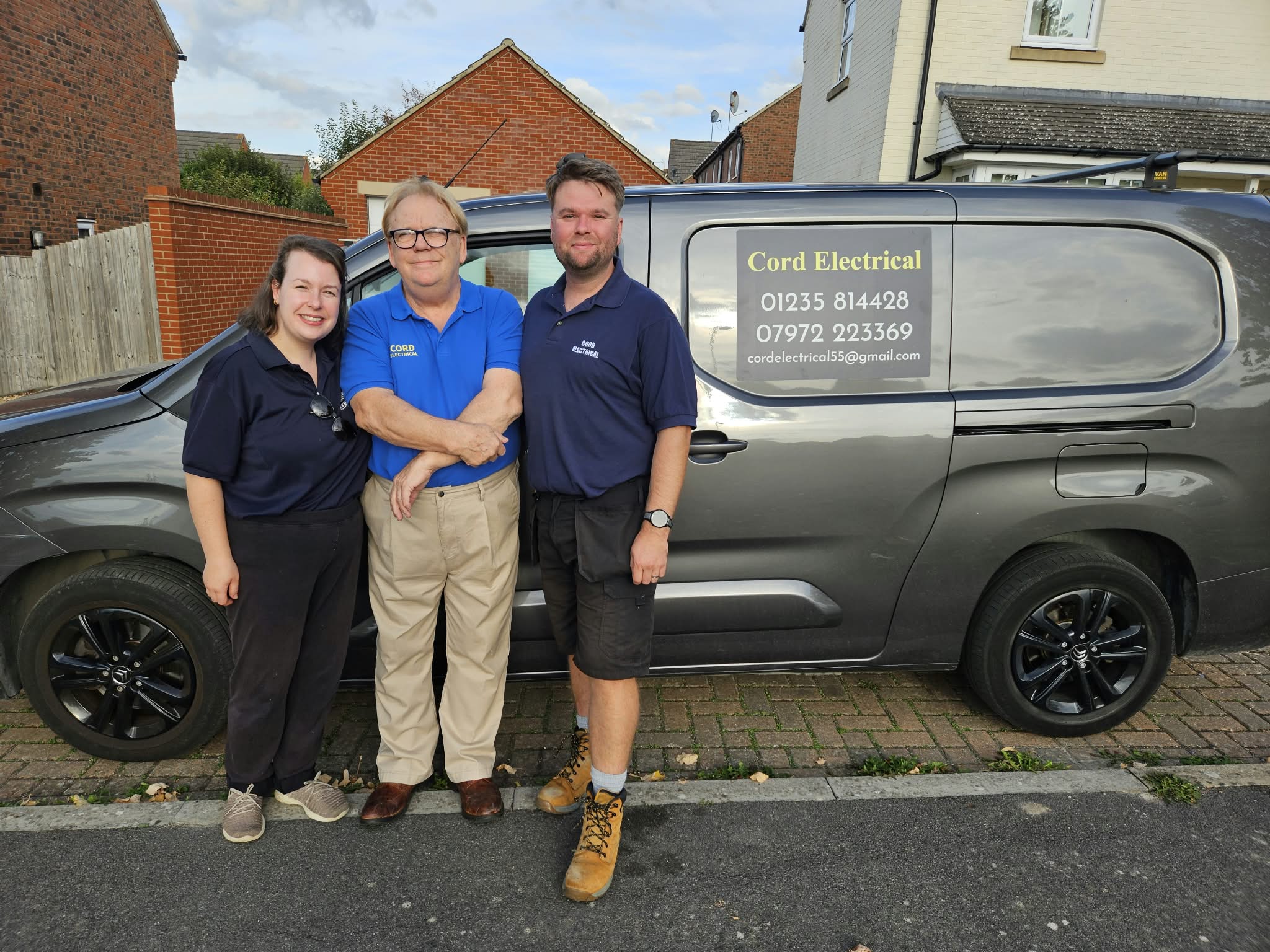 Colin, Carlie and Chris of Cord Electrical standing beside their van