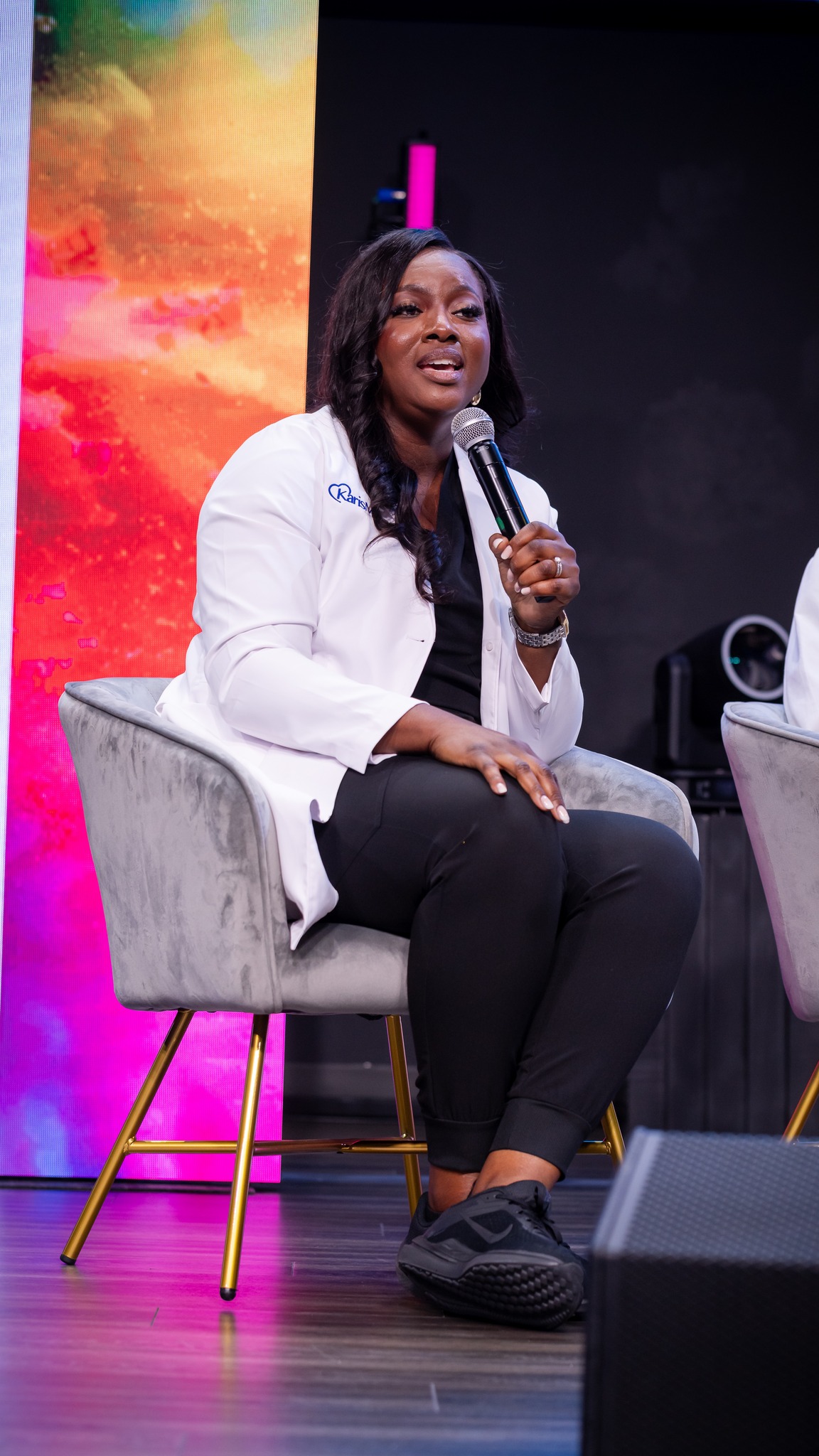 Dr. Vera speaking on stage