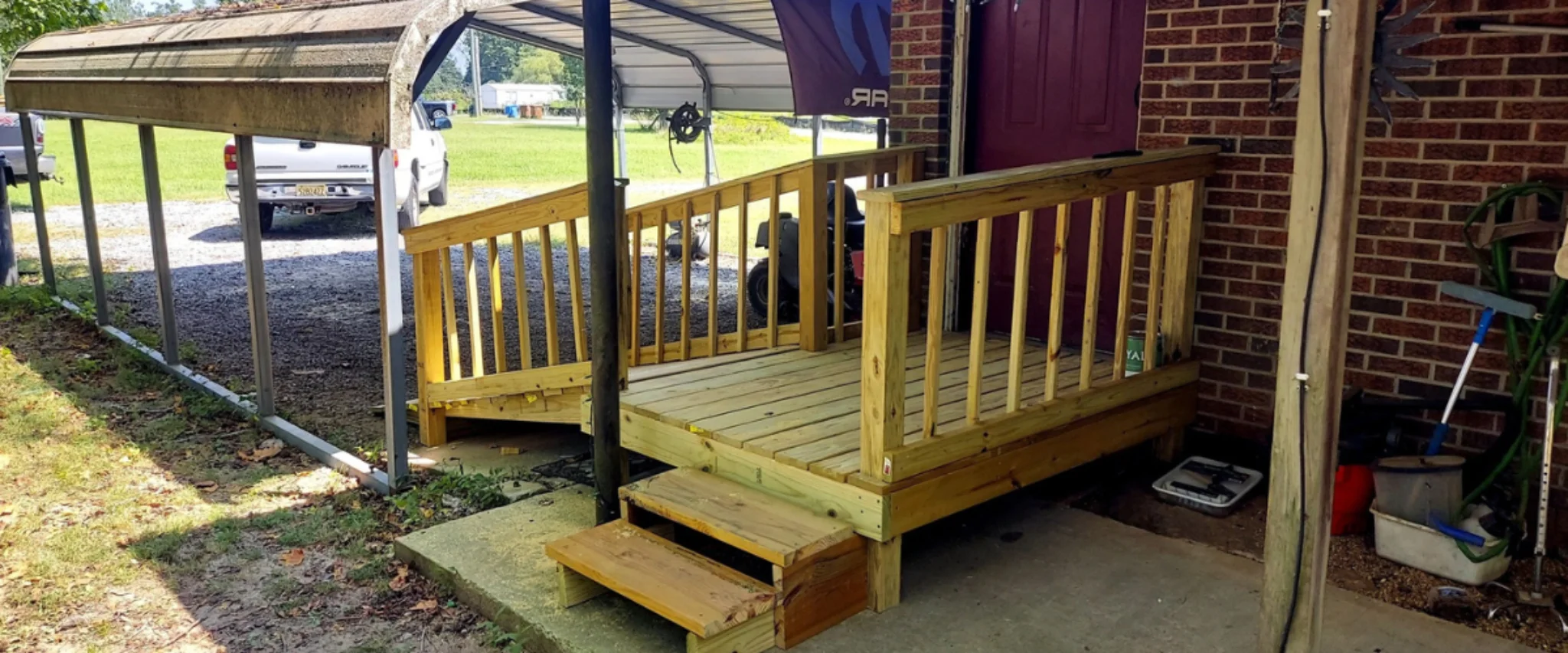 Covered porch wooden ramp installed for home accessibility