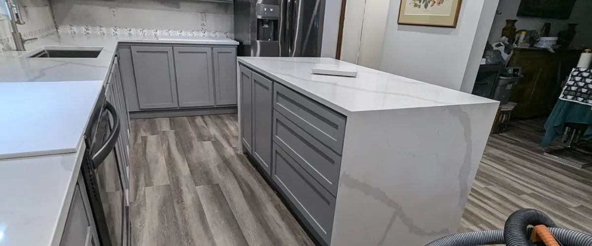 Modern kitchen island with custom cabinets and quartz countertop