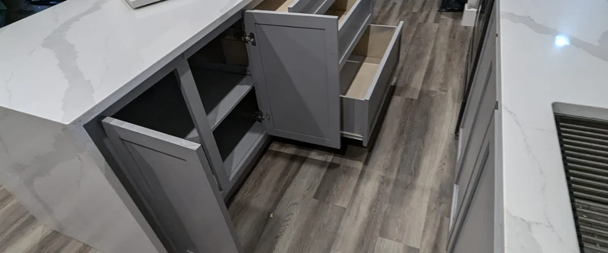 Modern kitchen island with custom cabinets and quartz countertop