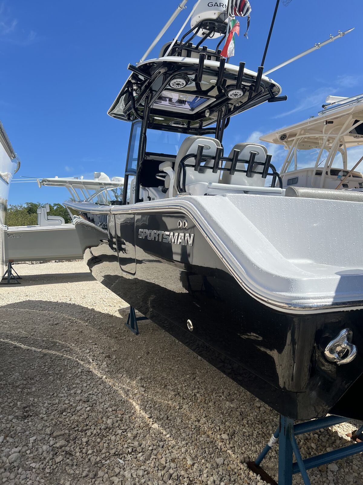 Black Sportsman center console with mirror-finish hull after boat detailing