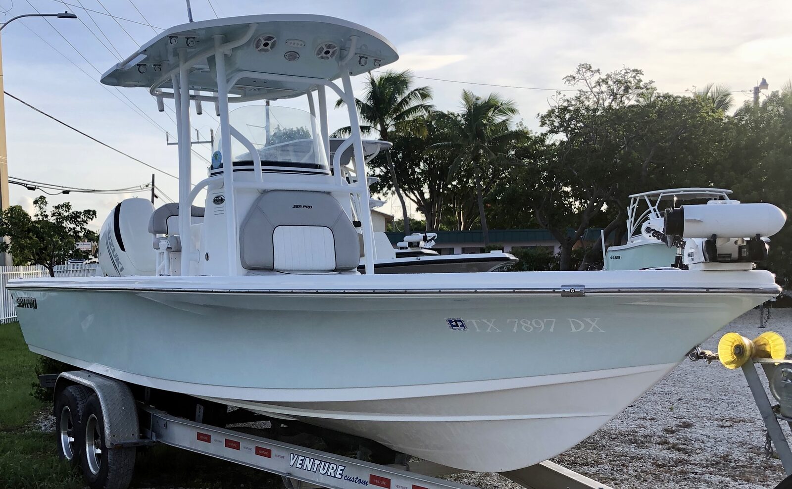 Detailed white bay boat on a trailer in the Florida Keys