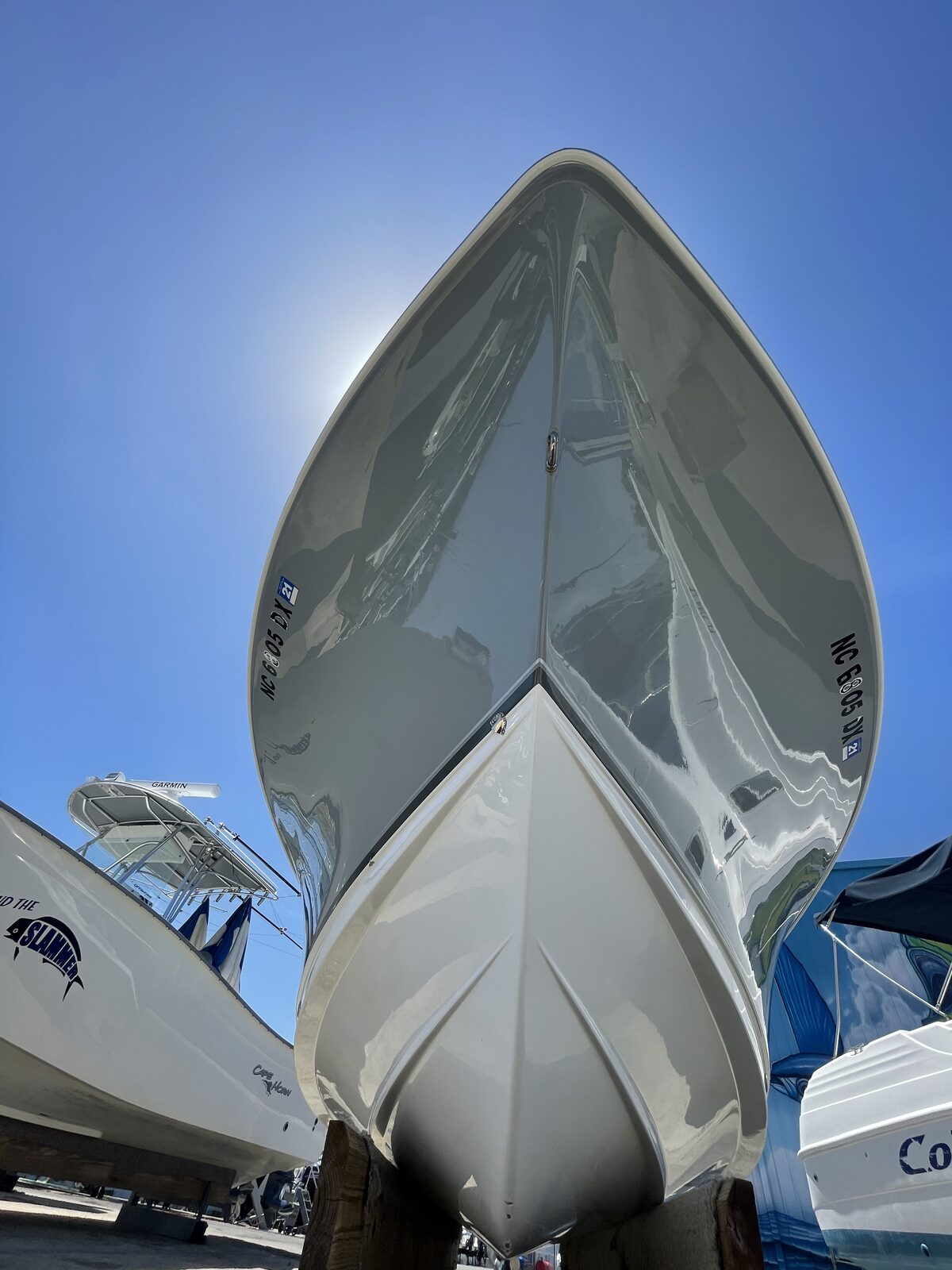 Gleaming white boat hull bow after oxidation removal and polish
