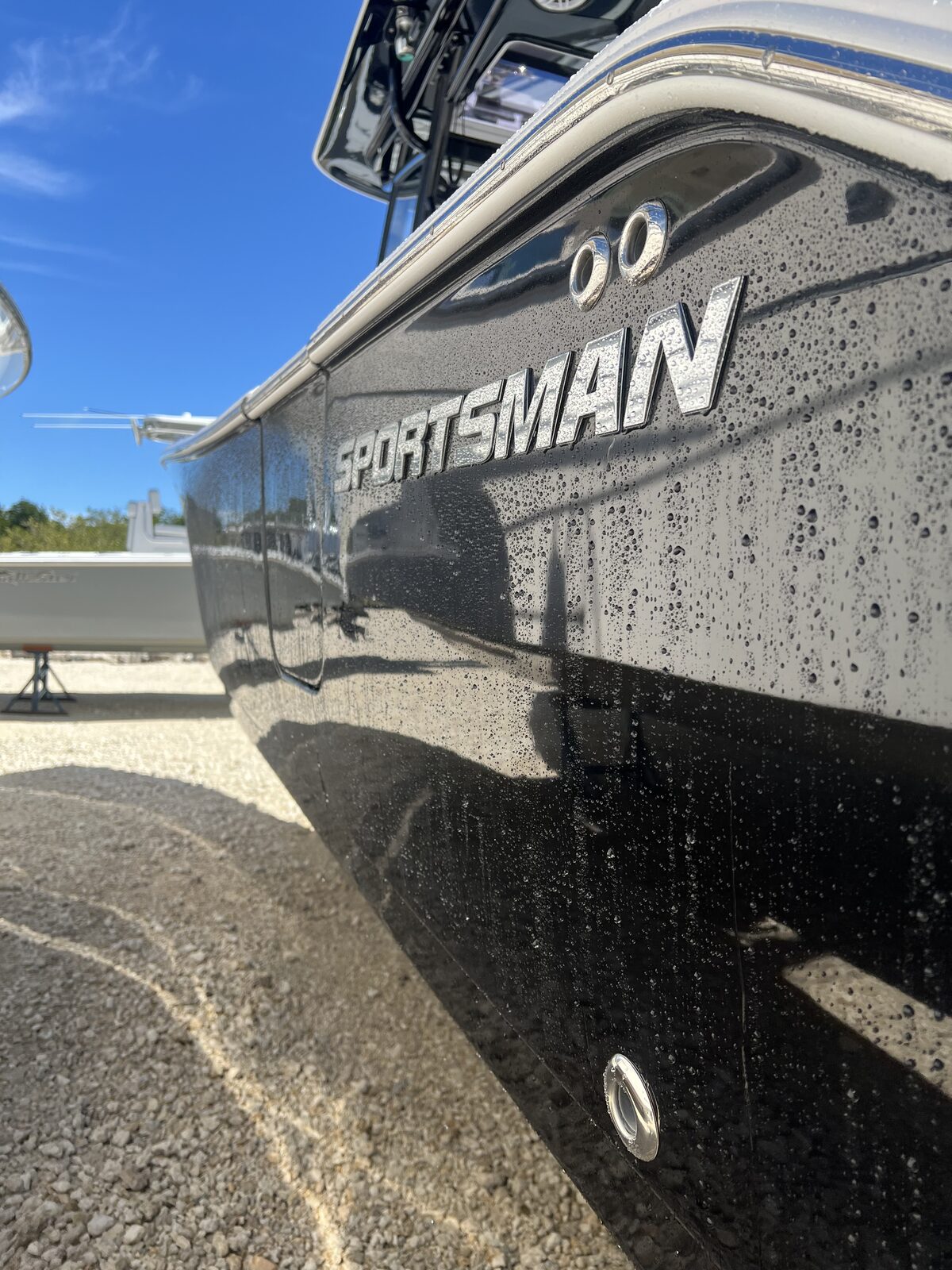 Polished black gel coat with water beading on a Sportsman boat