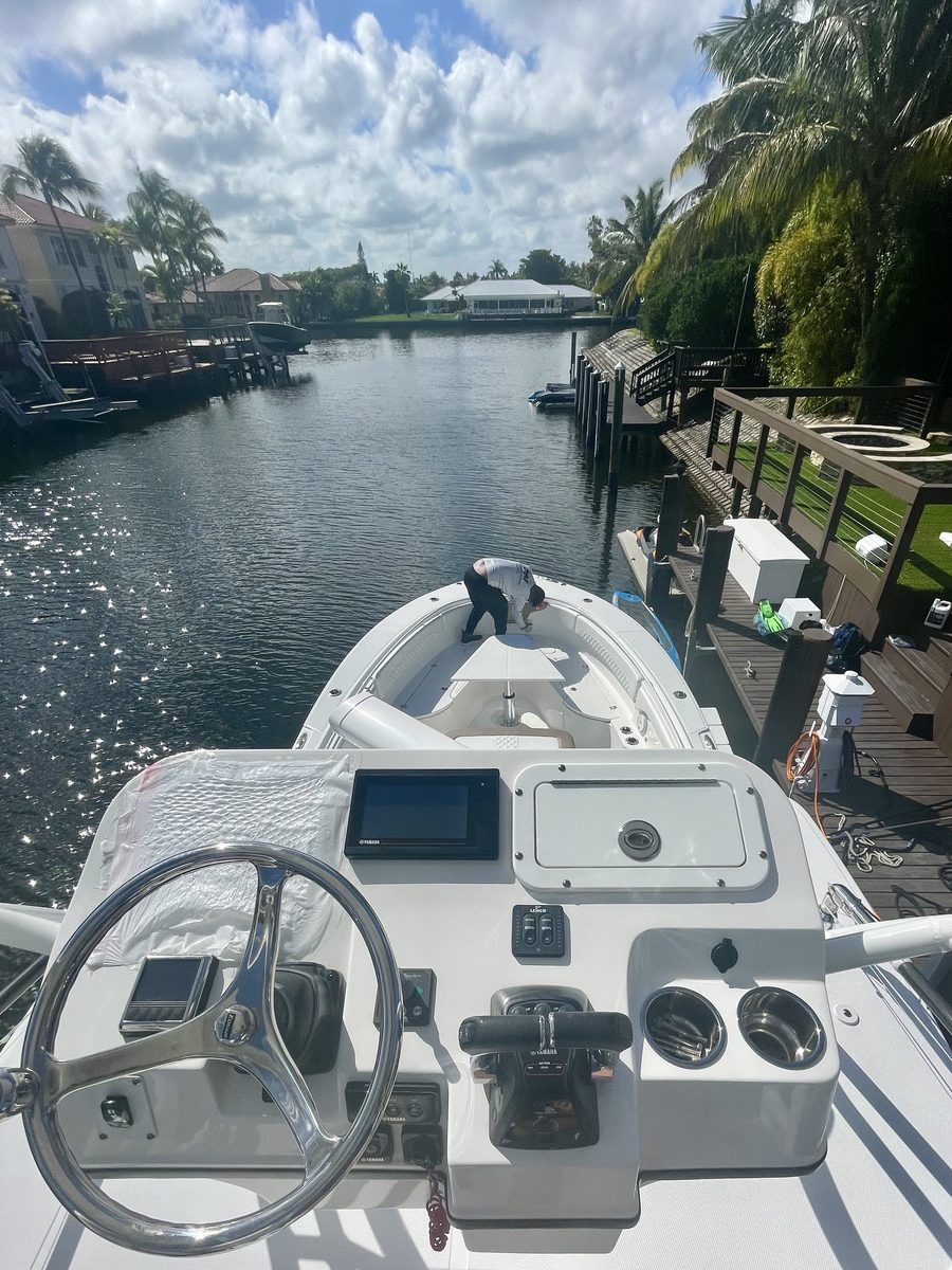 Fiberglass and gelcoat repair on a boat hull in the Florida Keys