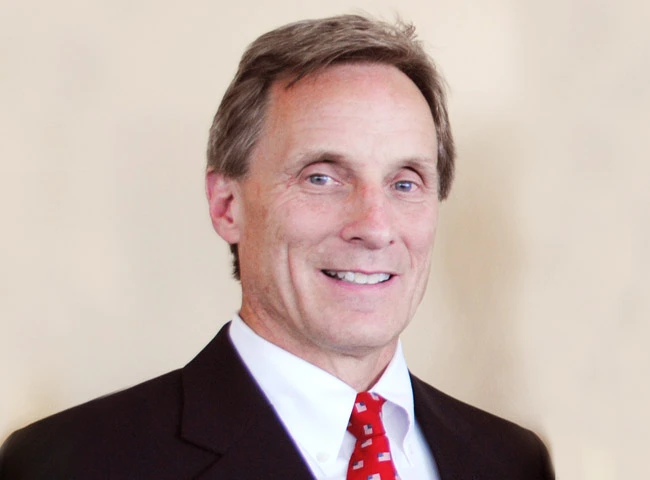 Glenn A. Mueller, President and COO of RPM Pizza LLC, the largest U.S. Domino's franchisee