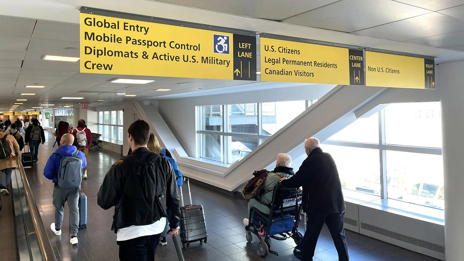 international travelers arriving at airport customs and border control