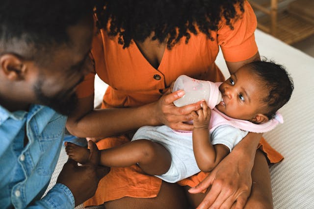 baby feeding from a bottle