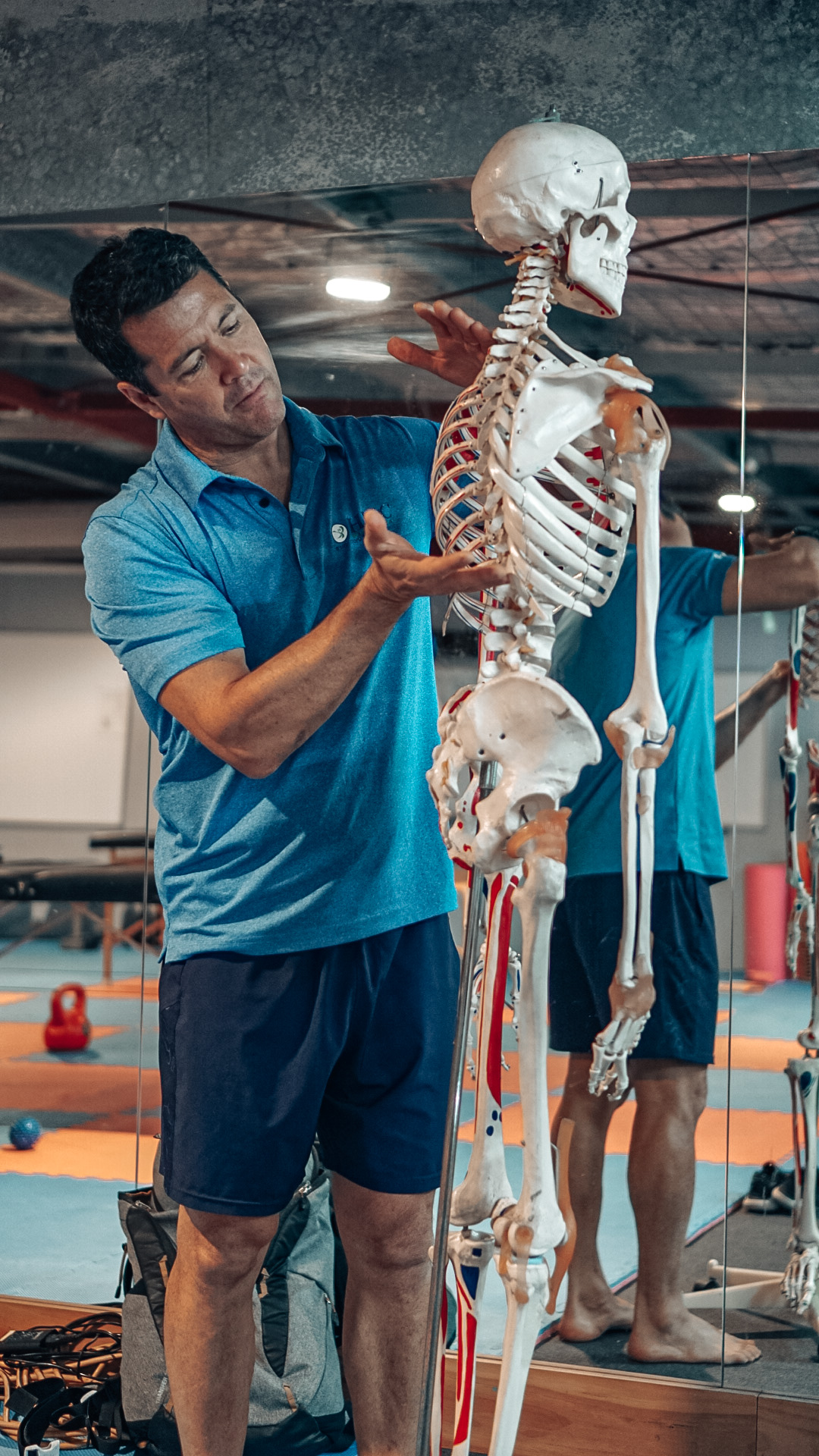 Dave Liow working with an anatomical skeleton in the gym