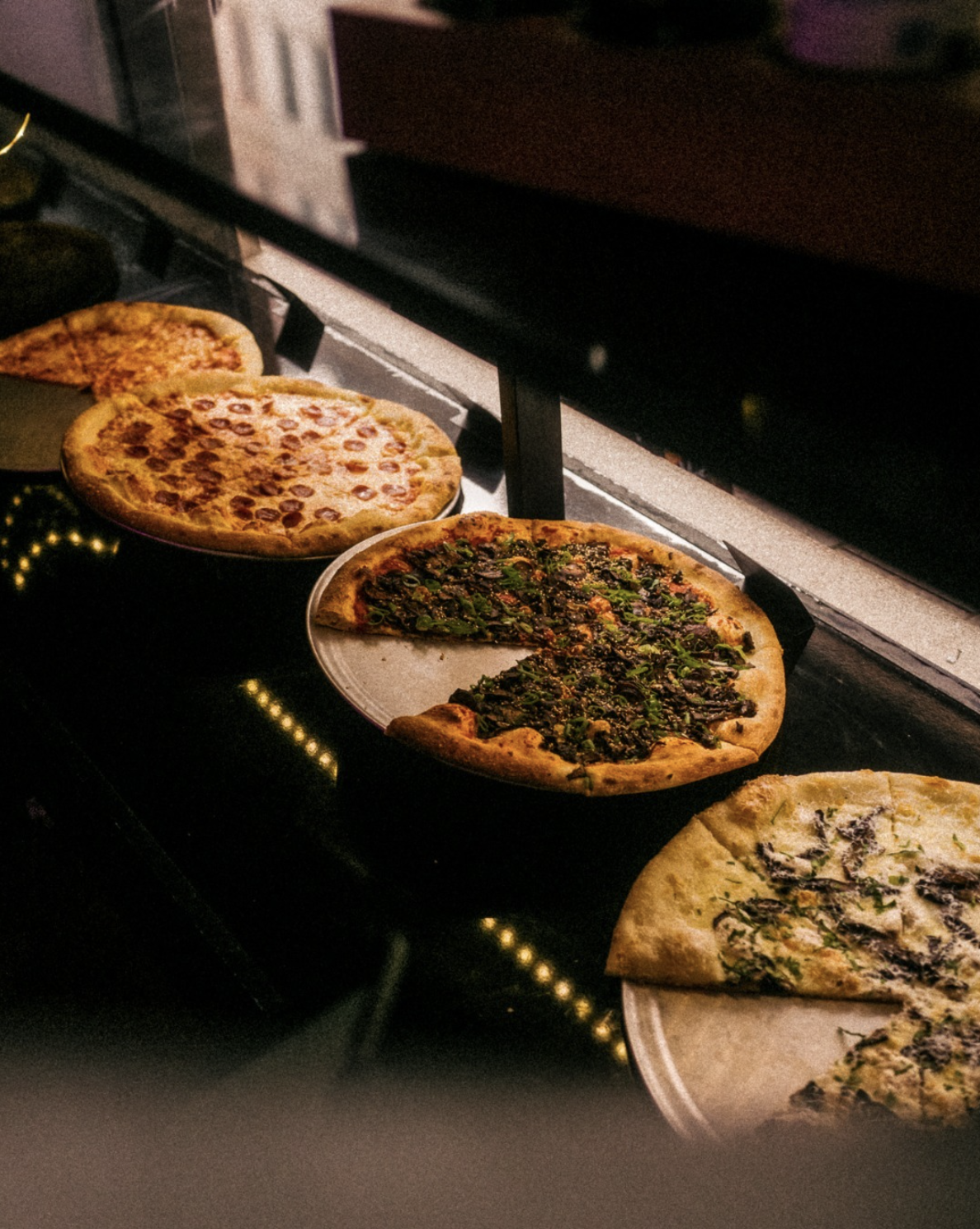 Pizzas fresh from the oven at Kinky Slice