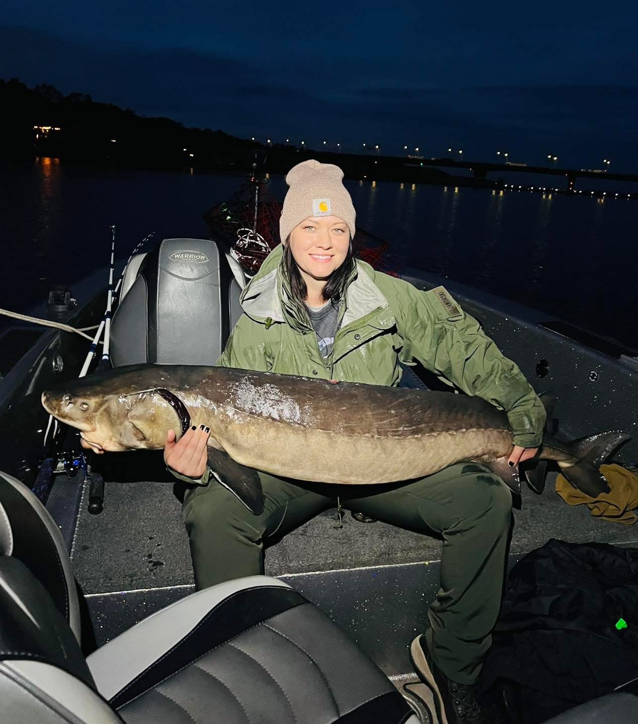 Lake sturgeon held boatside before release on the St. Croix River