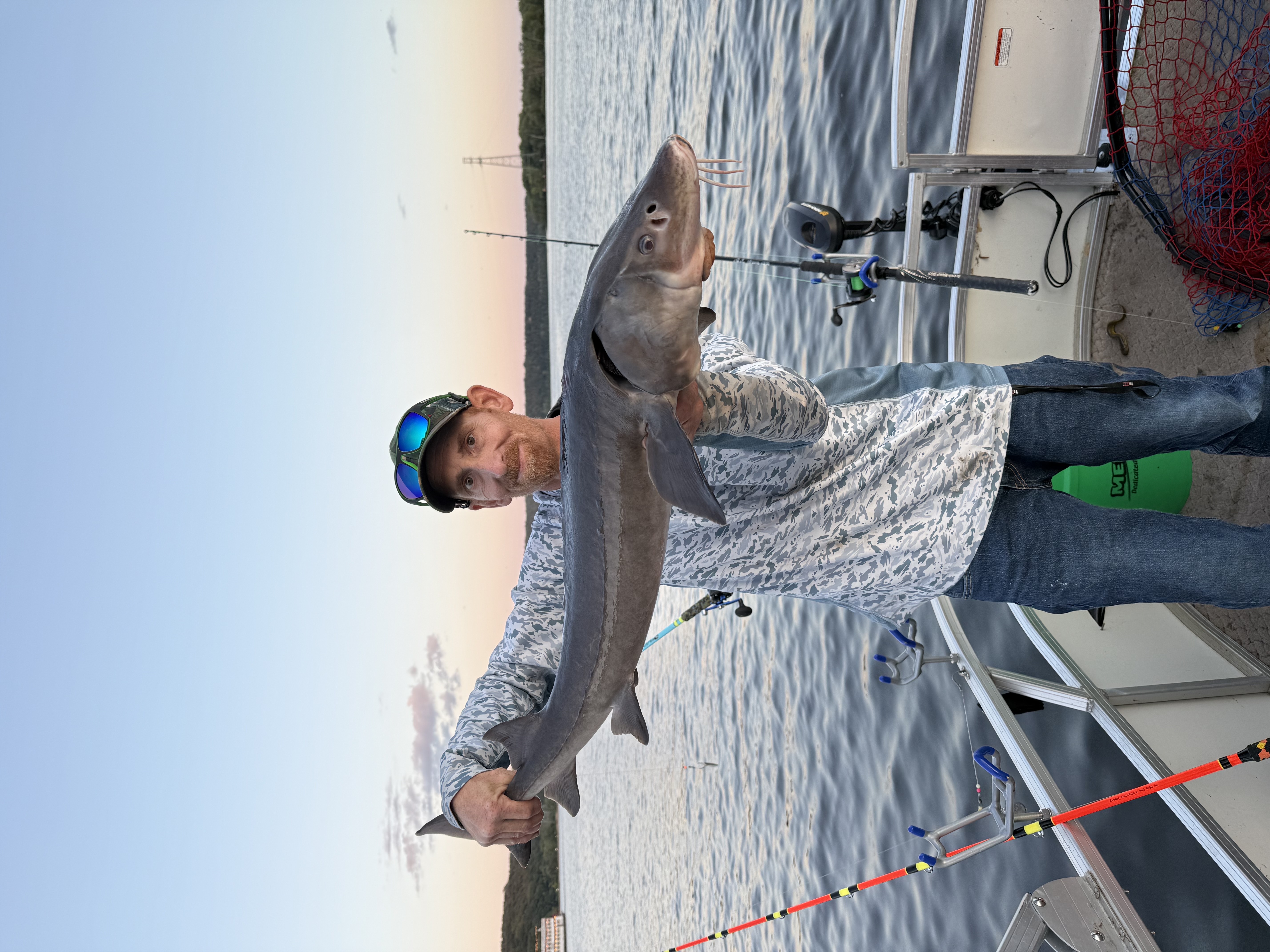 Holding a sturgeon on the St. Croix River