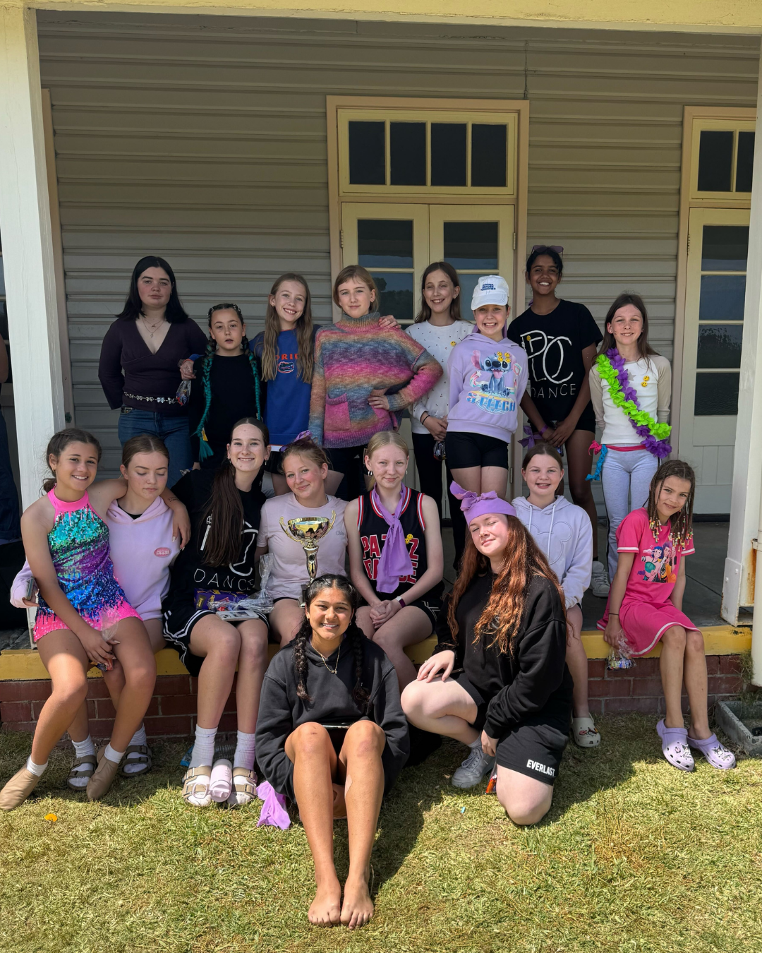 Students smiling and holding each other, enjoying the company of friends at dance class. Join our inclusive dance community in Belmont and Baldivis and explore diverse dance programs today!