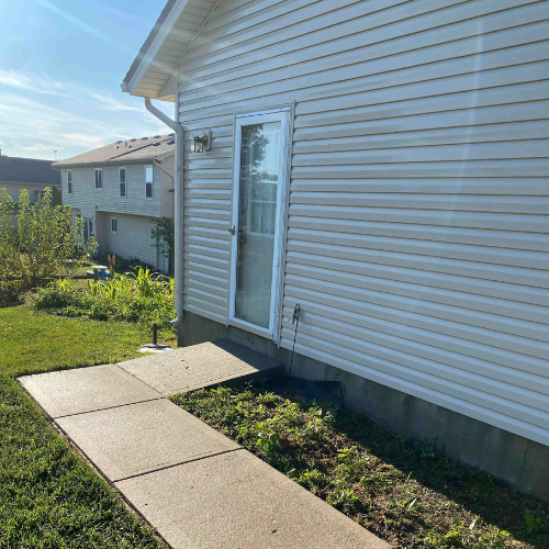 patio with dirt and moss before cleaning