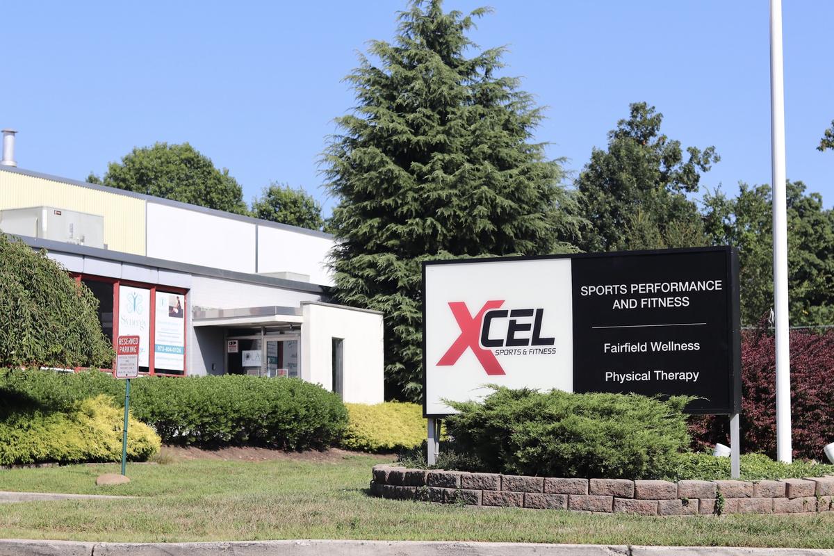XCEL Sports and Fitness entrance sign at 25 W Greenbrook Rd Fairfield NJ