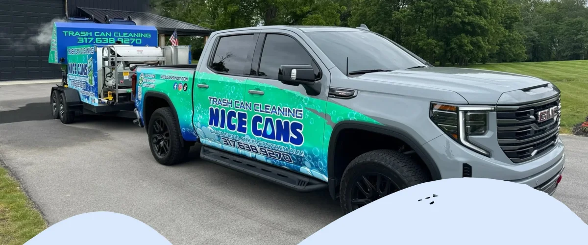A gray GMC truck with a vibrant green and blue wrap advertising 'Nice Cans Trash Can Cleaning,' pulling a cleaning trailer. A gray GMC truck with a vibrant green and blue wrap advertising 'Nice Cans Trash Can Cleaning,' pulling a cleaning trailer.