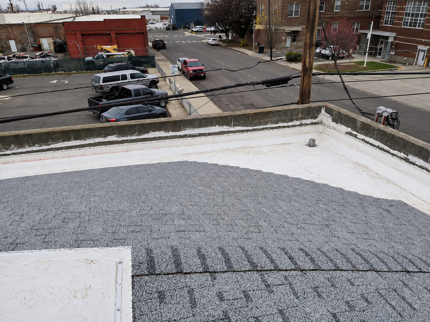 A+ Roofing roof repair service on a flat roof in the Tri-Cities, Washington